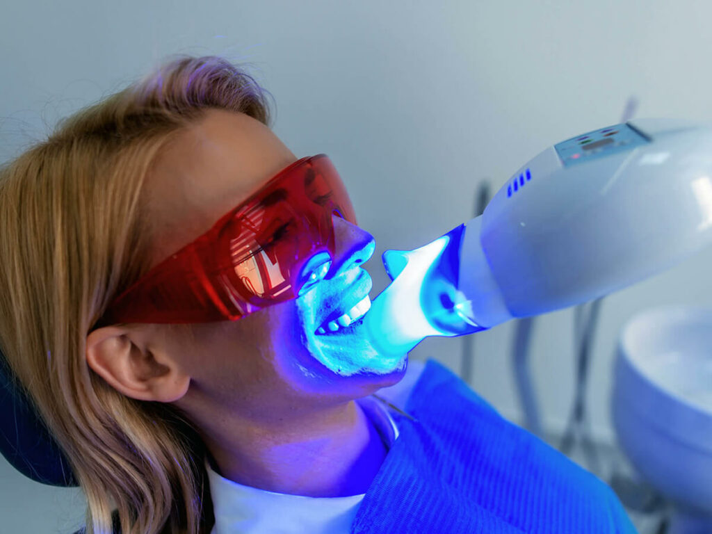 Image of a women getting her teeth whitened